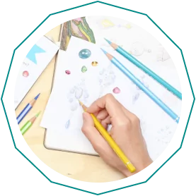 Hand drawing jewelry designs with colored pencils on white paper.  From a guide on jewelry making tools