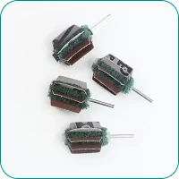 Four small cleaning drill brushes with layered scrubbing pads on a white background.