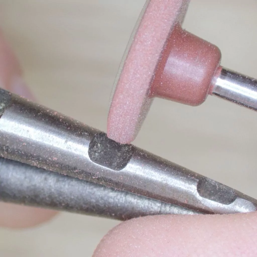 Modifying ring opening pliers with a rubber wheel for making paperclip link chain