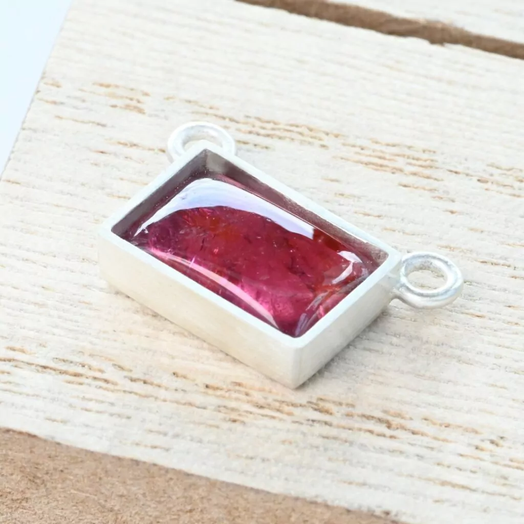 Tourmaline cabochon in a silver bezel