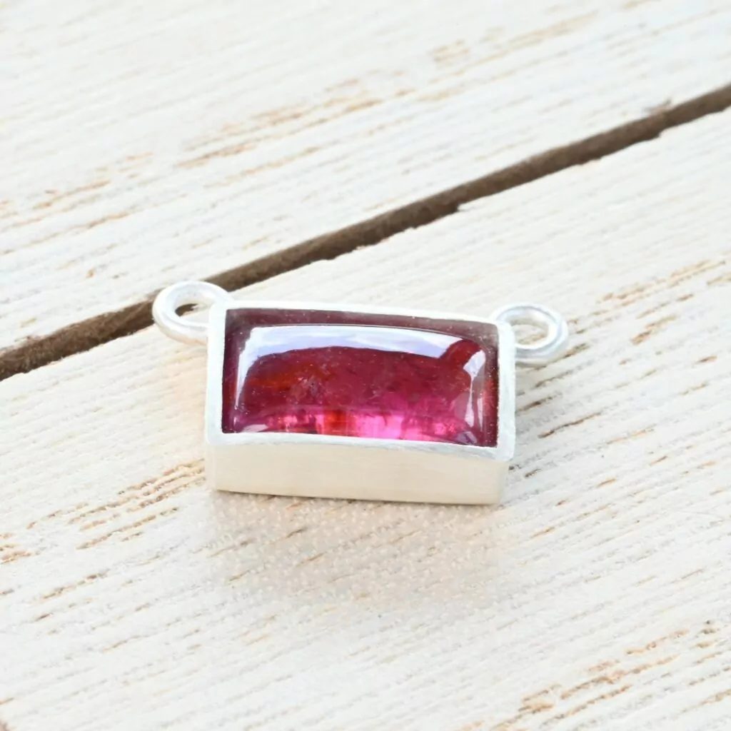 Tourmaline cabochon in a silver bezel