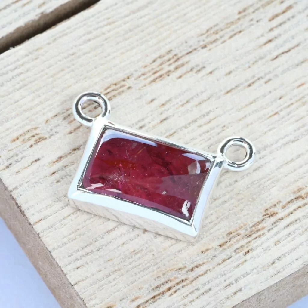 Tourmaline cabochon in a silver bezel