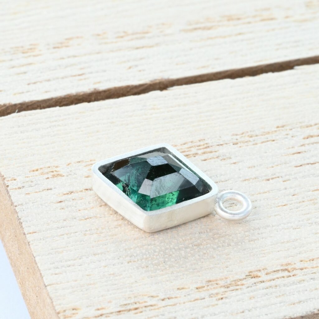 Tourmaline rose in a silver bezel