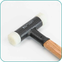 Rubber mallet with a wooden handle on a white background.