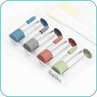 A set of colorful dental polishing tools with different shapes in a clear plastic case.