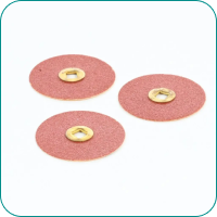 Three red circular sandpaper discs with central metal holes on a white background.