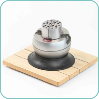Metal ball vise on a wooden base, used for jewelry making, against a white background.