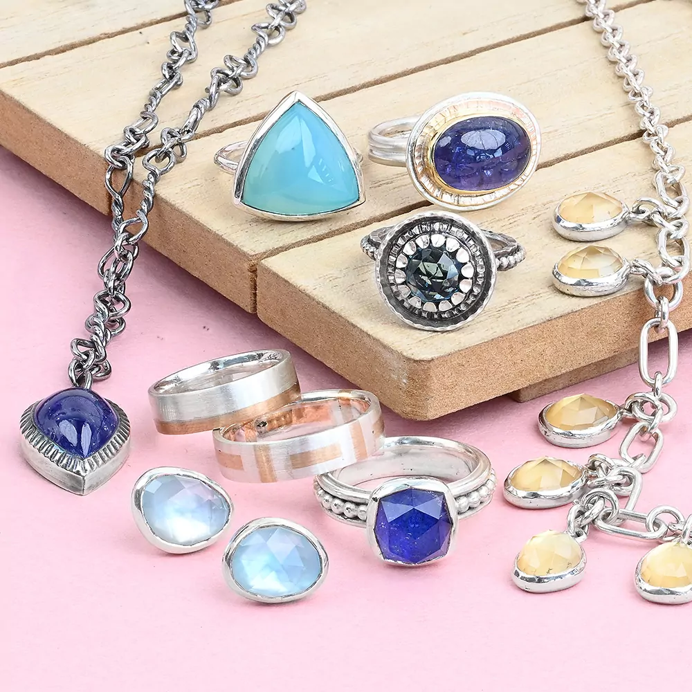 Hand made advanced jewelry making projects in sterling silver including a handmade chain with bezel settings, bezel set rings and bezel set earrings