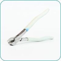 Diagonal cutting pliers with white handles on a light background.