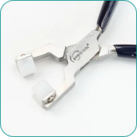 Pliers with black handles and white tips, used for gripping objects without scratching.