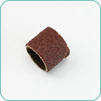 A cylindrical brown sanding drum on a white background.