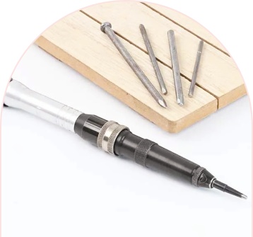 Screwdriver with multiple bits on wooden surface.