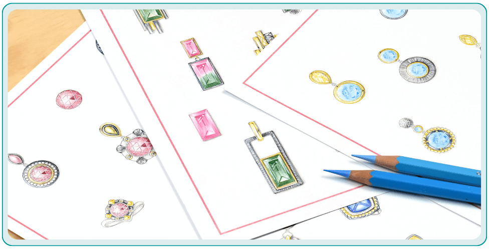 Drawings of various gem jewelry designs on paper, with two blue colored pencils nearby.  From a class on how to design jewelry.